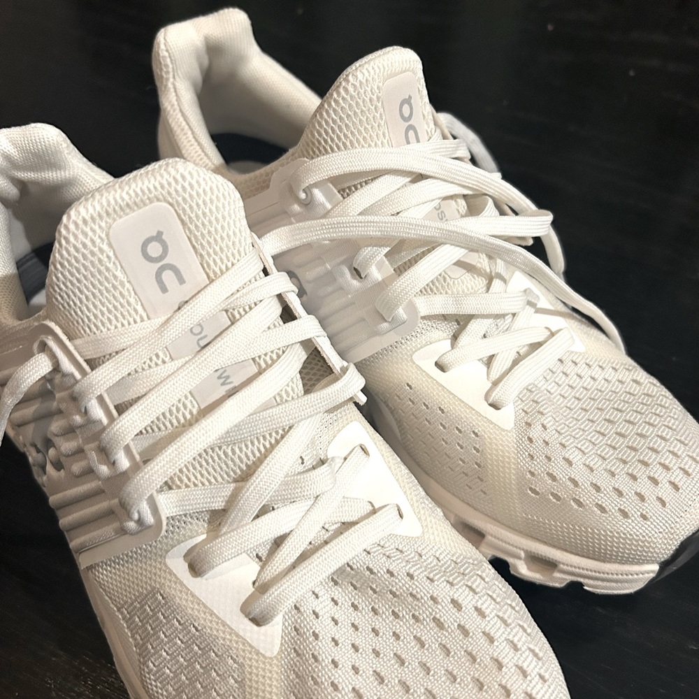 On cloud white tennis shoes